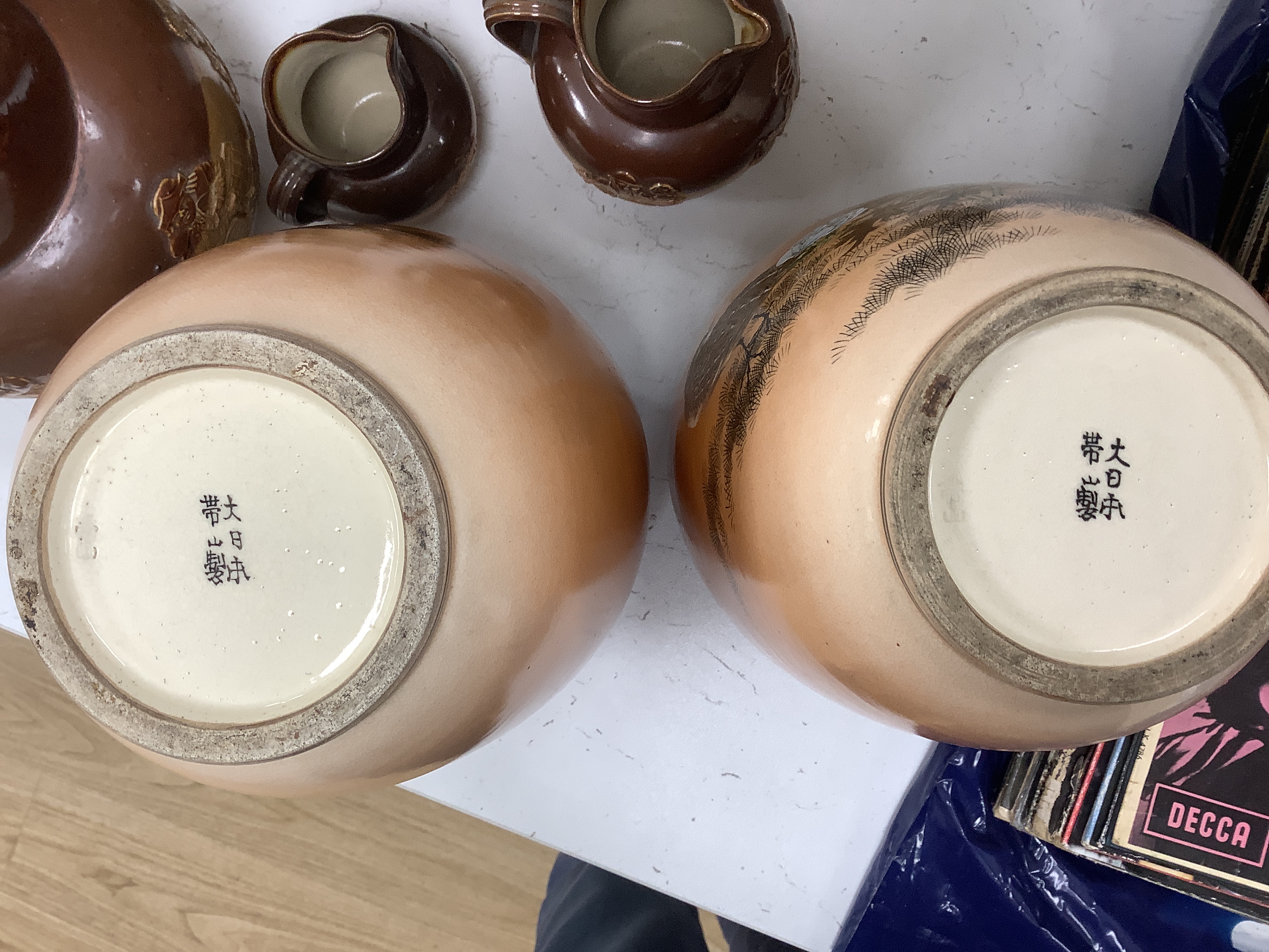 A pair of Japanese Satsuma vases, by Taizan and four others including a lidded jar and a basket vase stamped Noritake, tallest 25cm